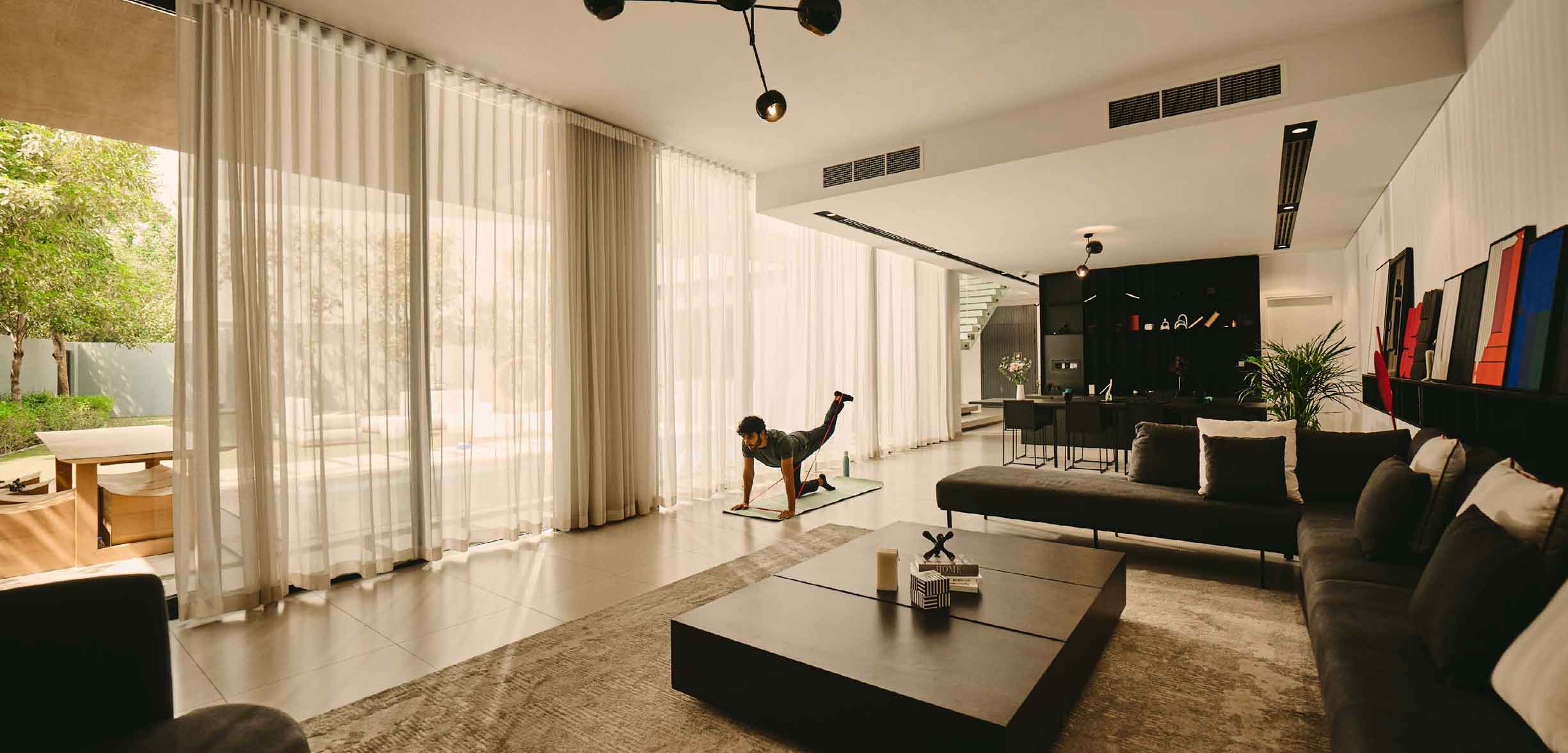 actual footage of living dining by the pool of signature villa